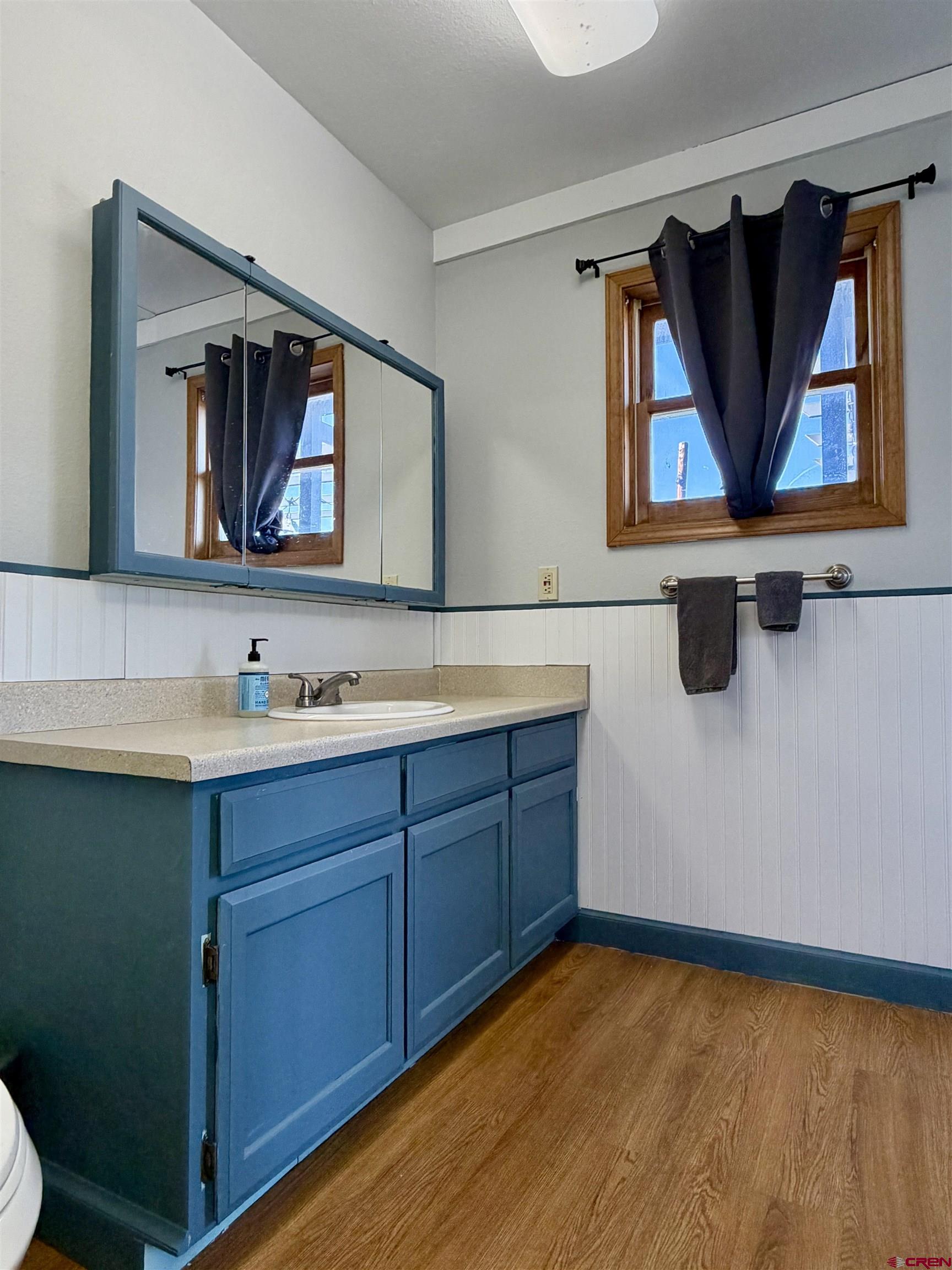 18377 Highway 65 Cedaredge, CO 81413 - Photo 14 of 45 a bathroom with a sink mirror and vanity