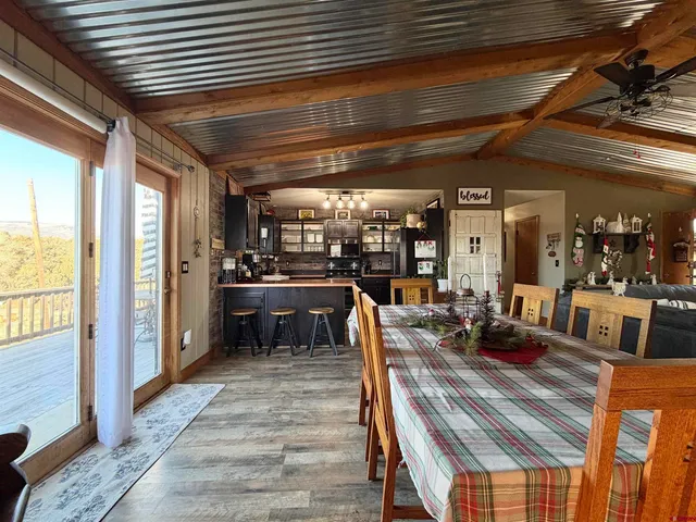 a view of a patio with table and chairs