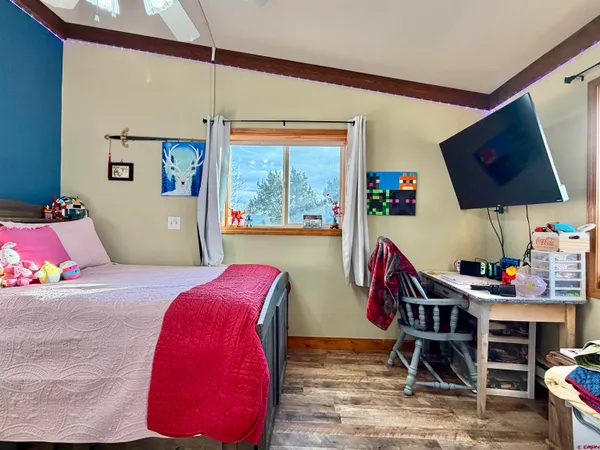 a bedroom with furniture and a window