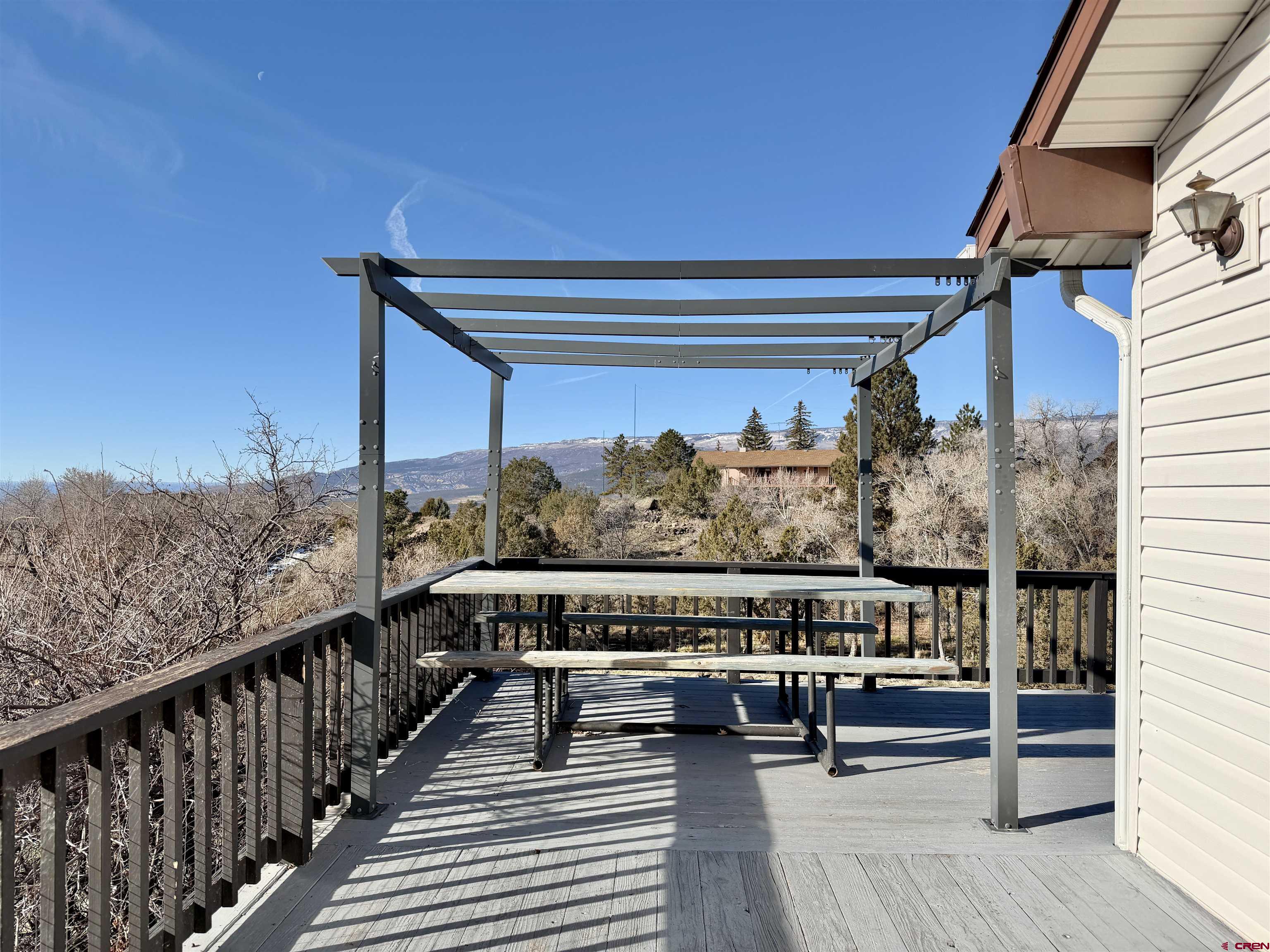 18377 Highway 65 Cedaredge, CO 81413 - Photo 23 of 45 a view of a balcony with couches and wooden floor