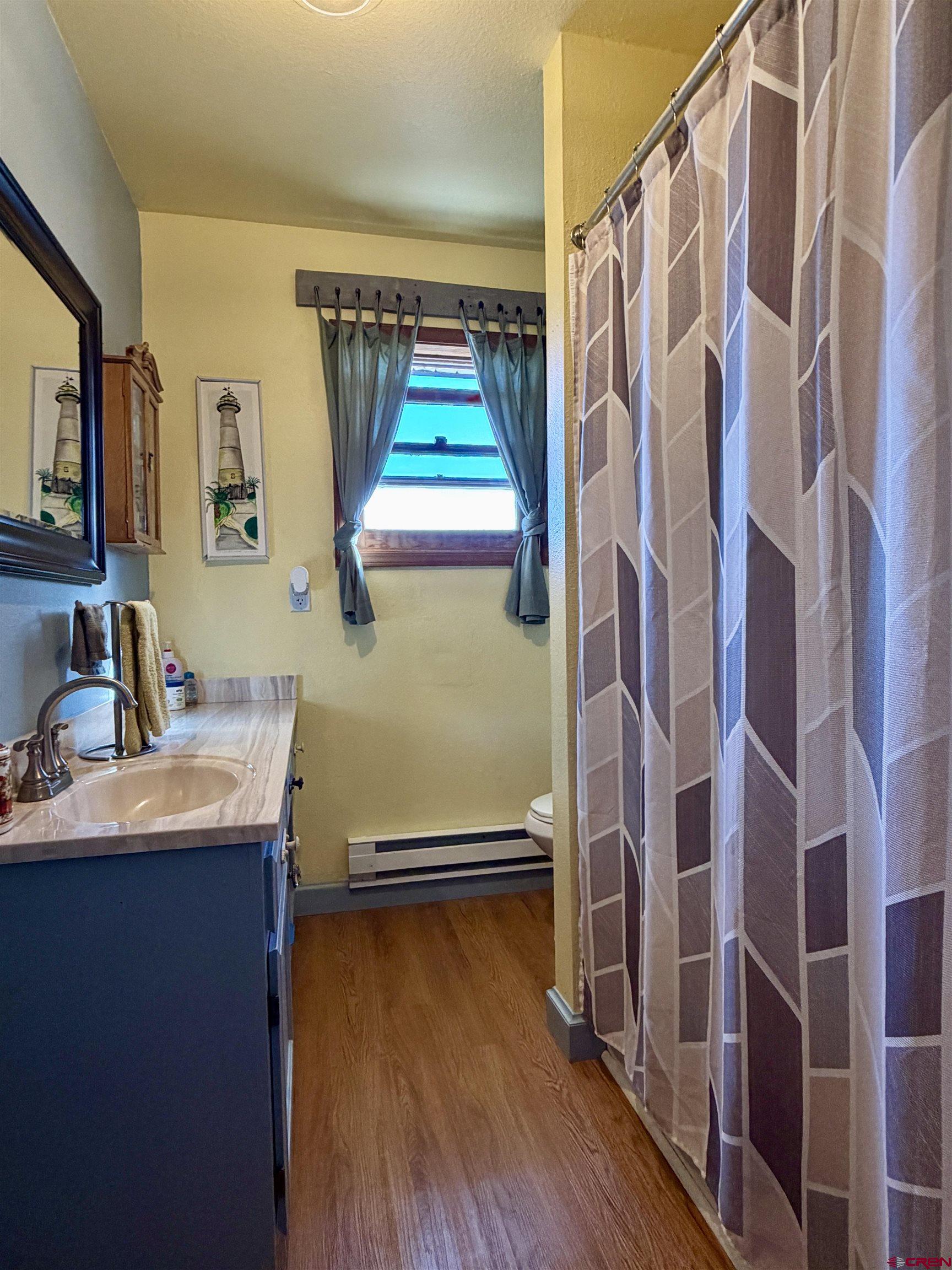 18377 Highway 65 Cedaredge, CO 81413 - Photo 28 of 45 a bathroom with a sink and a mirror