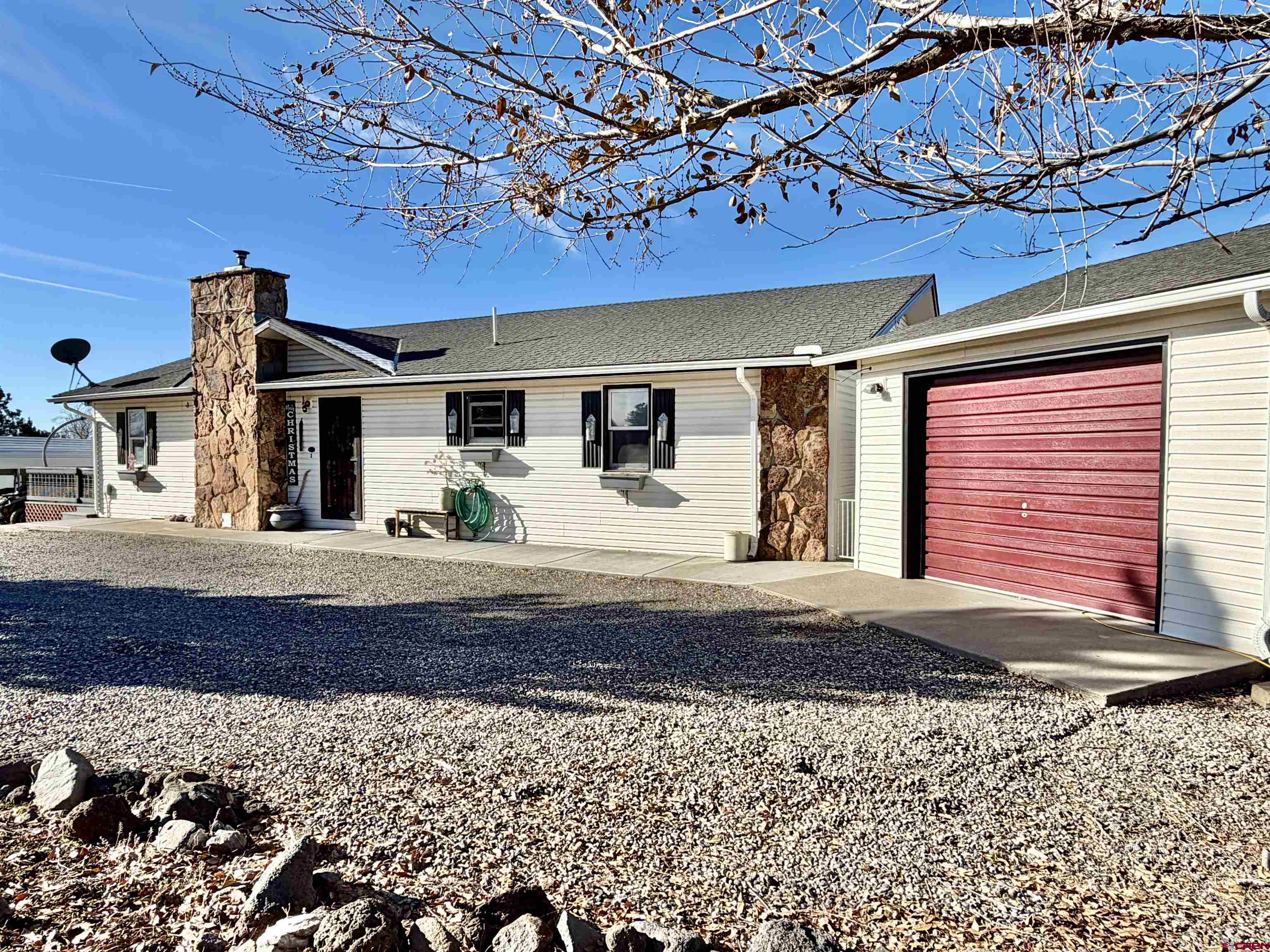 18377 Highway 65 Cedaredge, CO 81413 - Photo 3 of 45 a view of a house with a patio