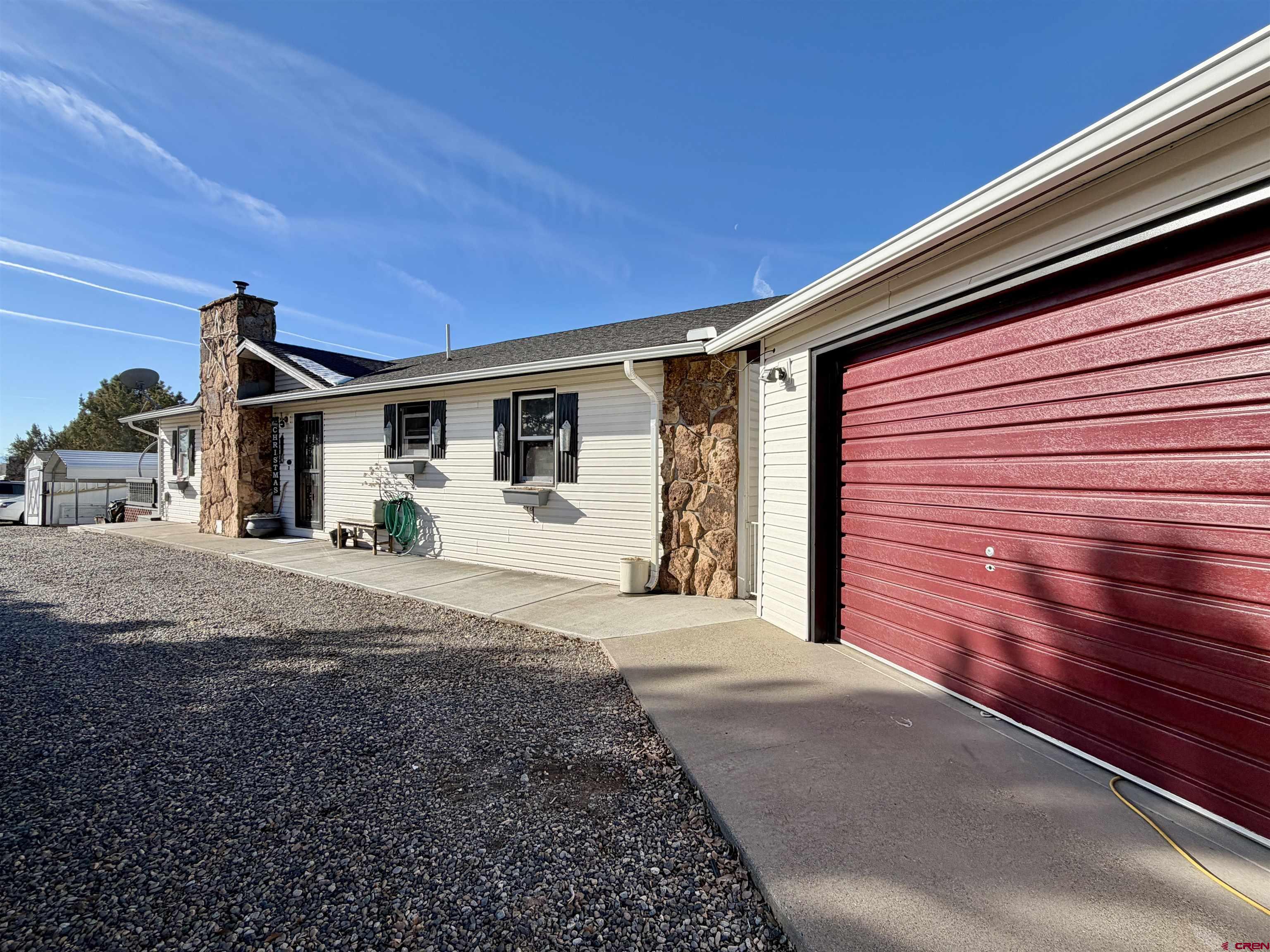18377 Highway 65 Cedaredge, CO 81413 - Photo 34 of 45 a front view of a house with a yard
