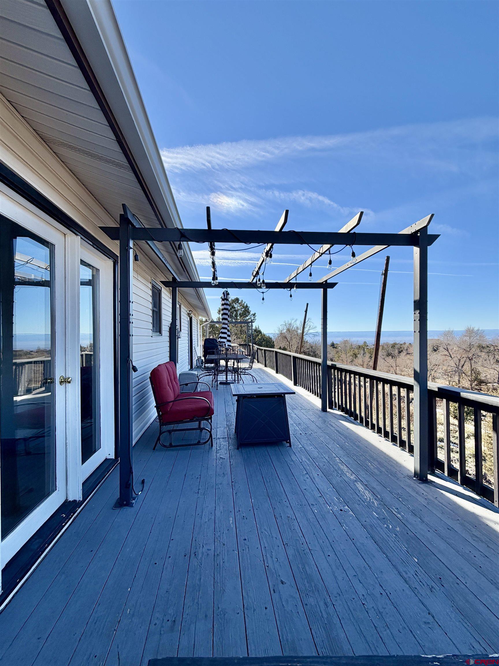 18377 Highway 65 Cedaredge, CO 81413 - Photo 36 of 45 a roof deck with table and chairs