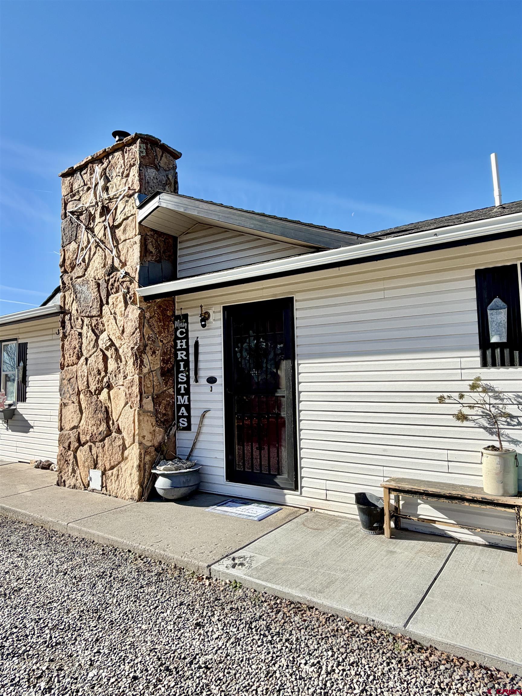 18377 Highway 65 Cedaredge, CO 81413 - Photo 4 of 45 a view of a house with a door