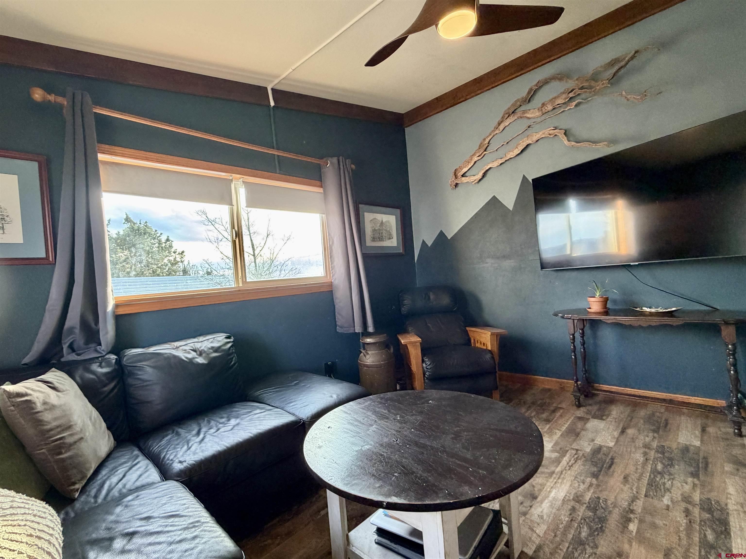 18377 Highway 65 Cedaredge, CO 81413 - Photo 41 of 45 a living room with furniture and a large window