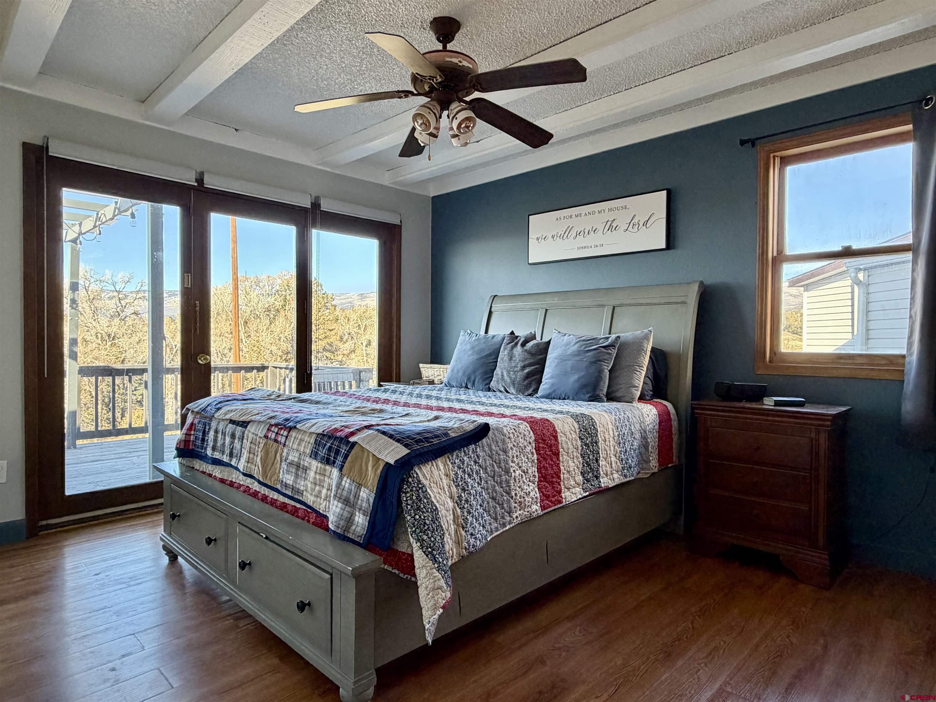 18377 Highway 65 Cedaredge, CO 81413 - Photo 45 of 45 a large bed sitting in a bedroom next to a window
