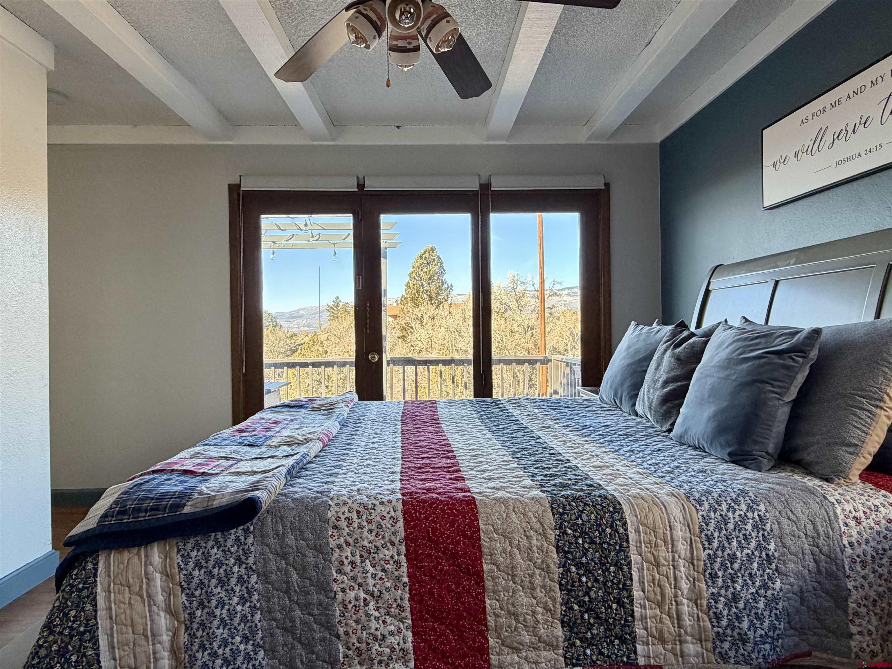 18377 Highway 65 Cedaredge, CO 81413 - Photo 10 of 45 a bed sitting in a bedroom next to a window
