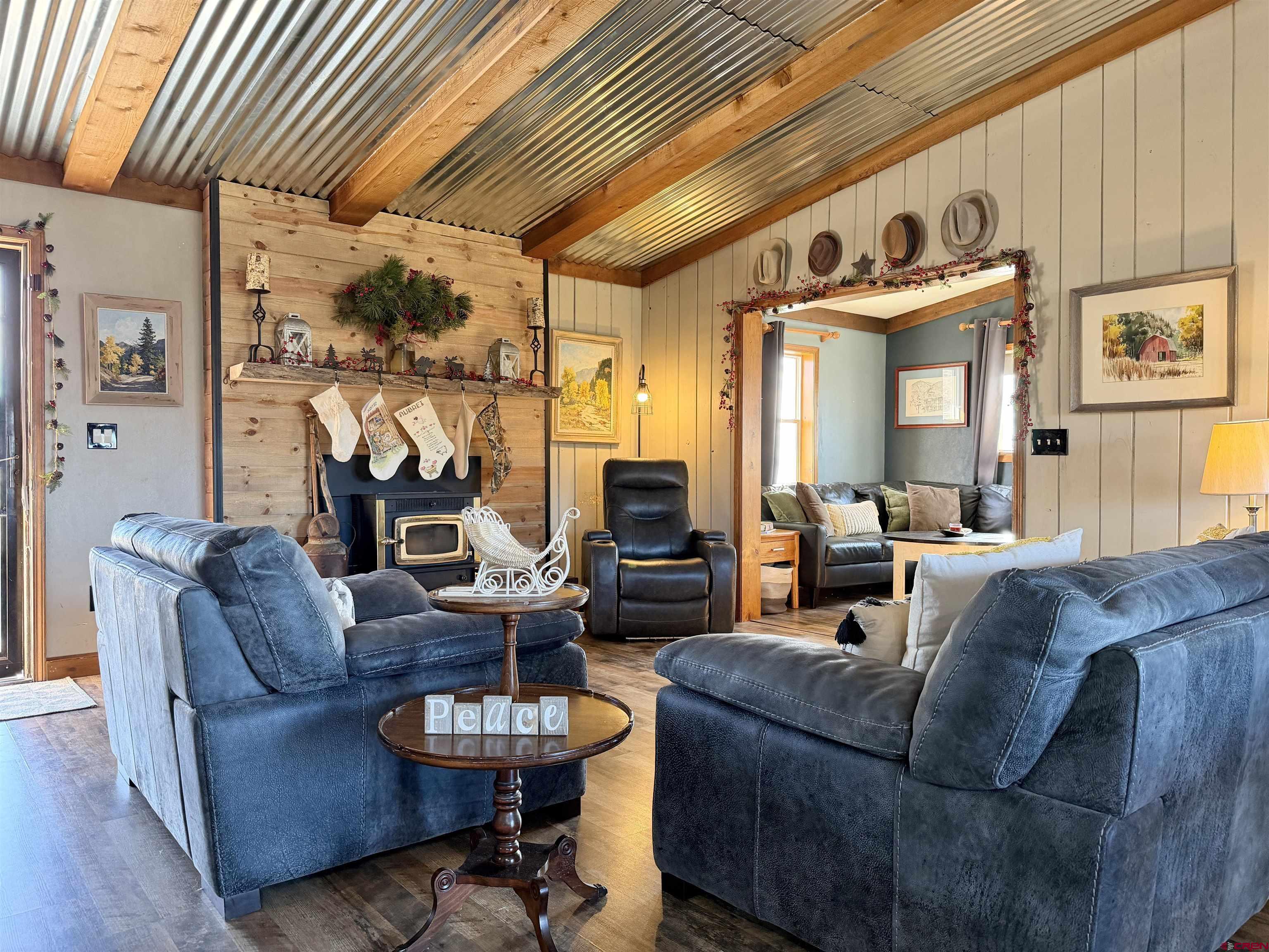 18377 Highway 65 Cedaredge, CO 81413 - Photo 10 of 45 a living room with furniture and a large window