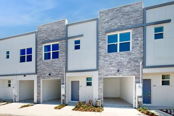 a front view of a house with yard