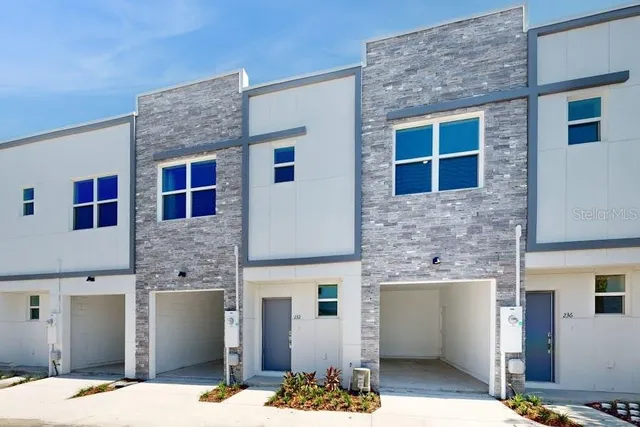 a front view of a house with yard
