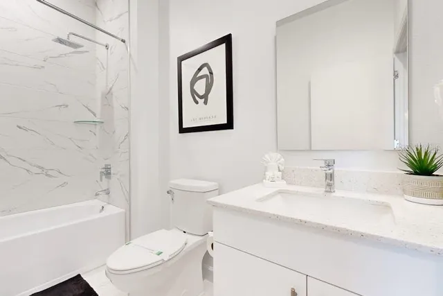 a bathroom with a sink a toilet and a bathtub