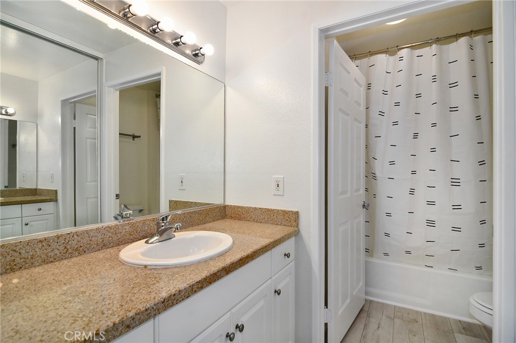 5510 Owensmouth Avenue, Unit 301 Woodland Hills, CA 91367 - Photo 9 of 22 a bathroom with a sink a toilet and shower