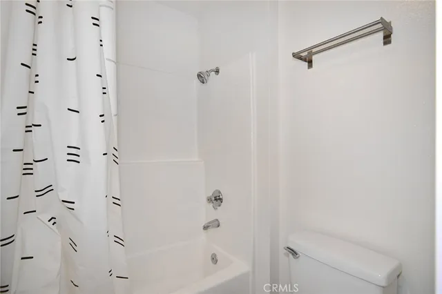 a bathroom with a bathtub and shower