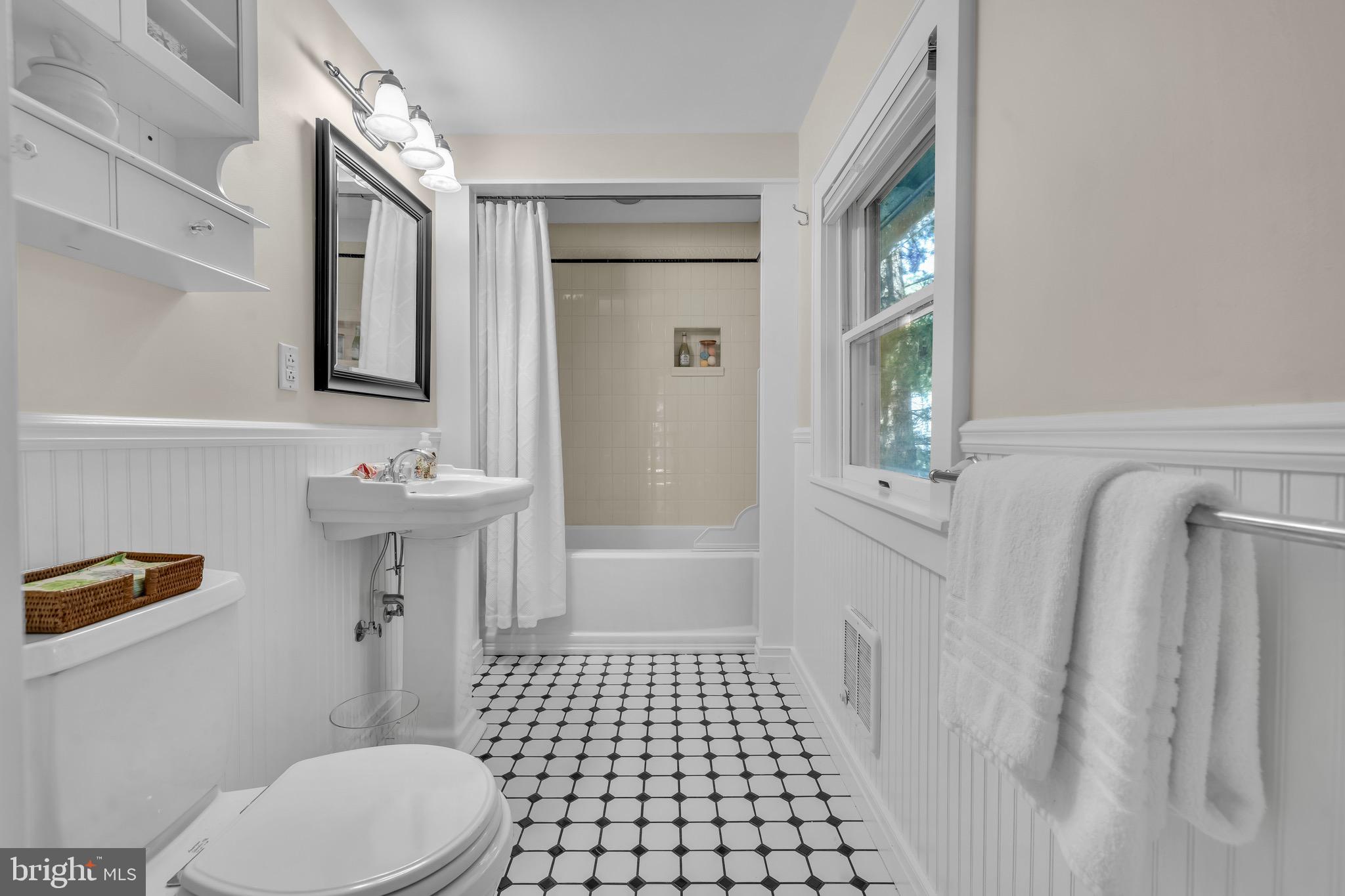 21424 Wharf Road Tilghman, MD 21671 - Photo 16 of 47 a bathroom with a sink a toilet and shower