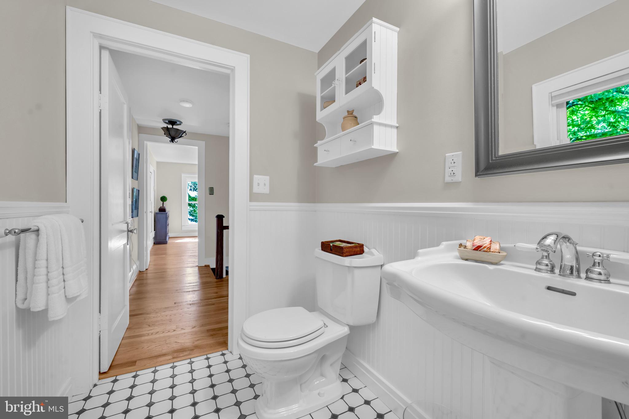 21424 Wharf Road Tilghman, MD 21671 - Photo 17 of 47 a bathroom with a sink toilet and shower