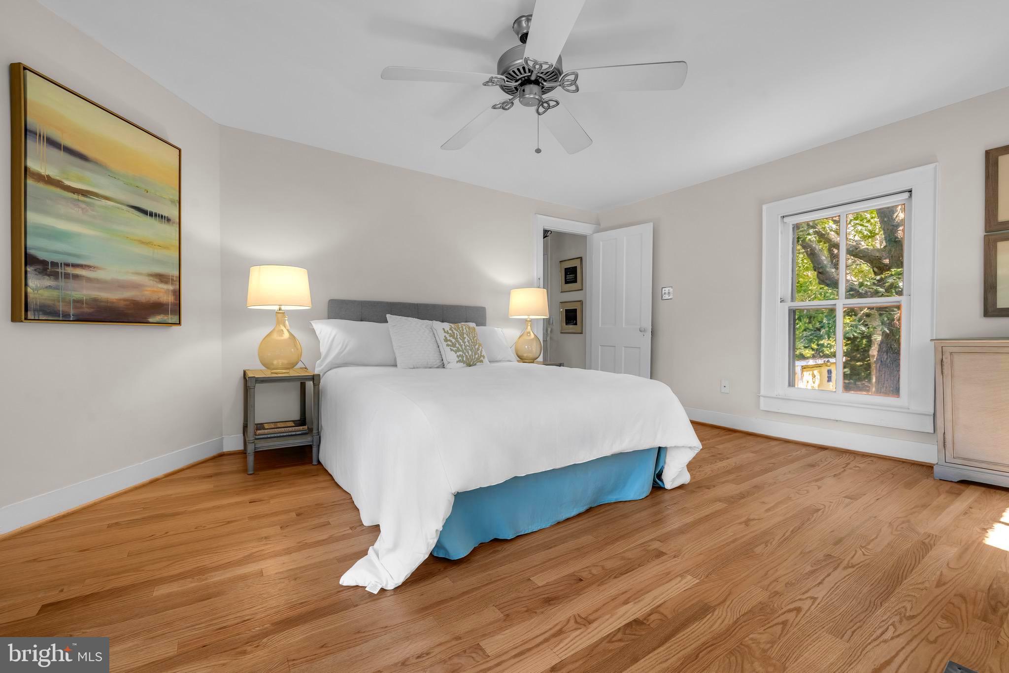 21424 Wharf Road Tilghman, MD 21671 - Photo 21 of 47 a bedroom with a bed and a window