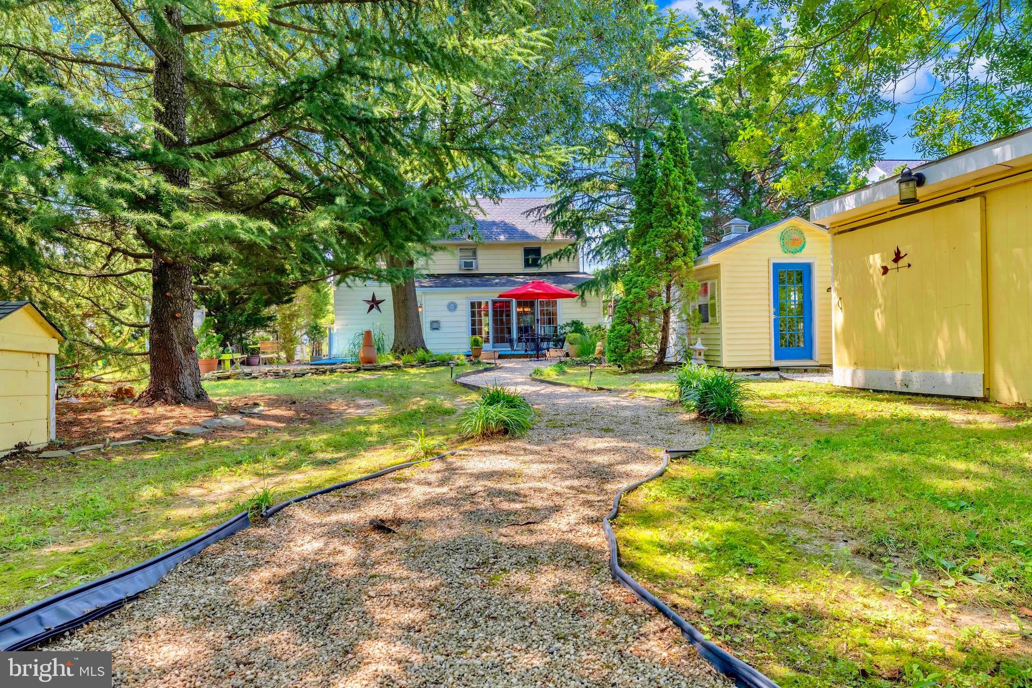 21424 Wharf Road Tilghman, MD 21671 - Photo 26 of 47 a front view of house with yard
