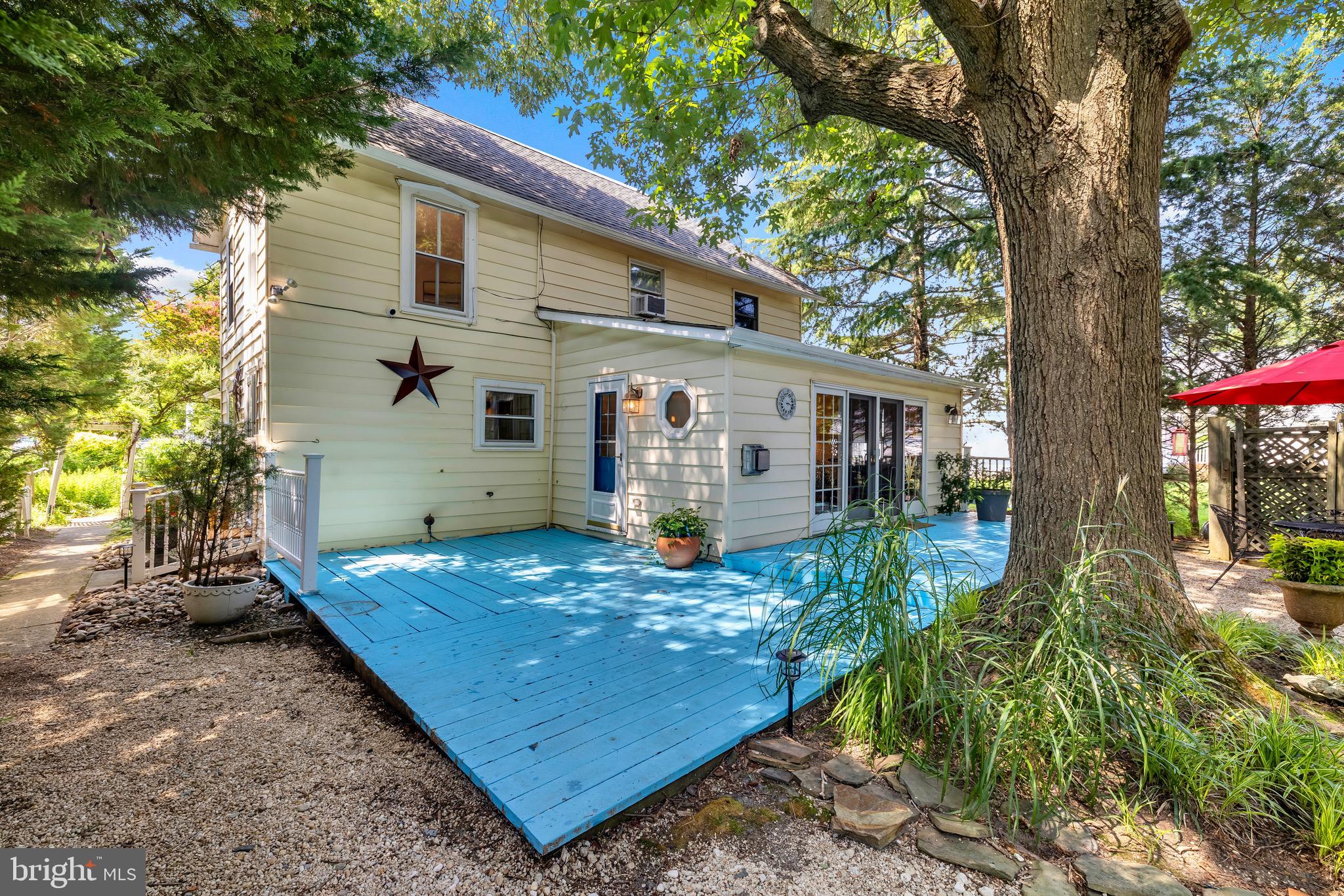 21424 Wharf Road Tilghman, MD 21671 - Photo 28 of 47 front view of a house with a yard