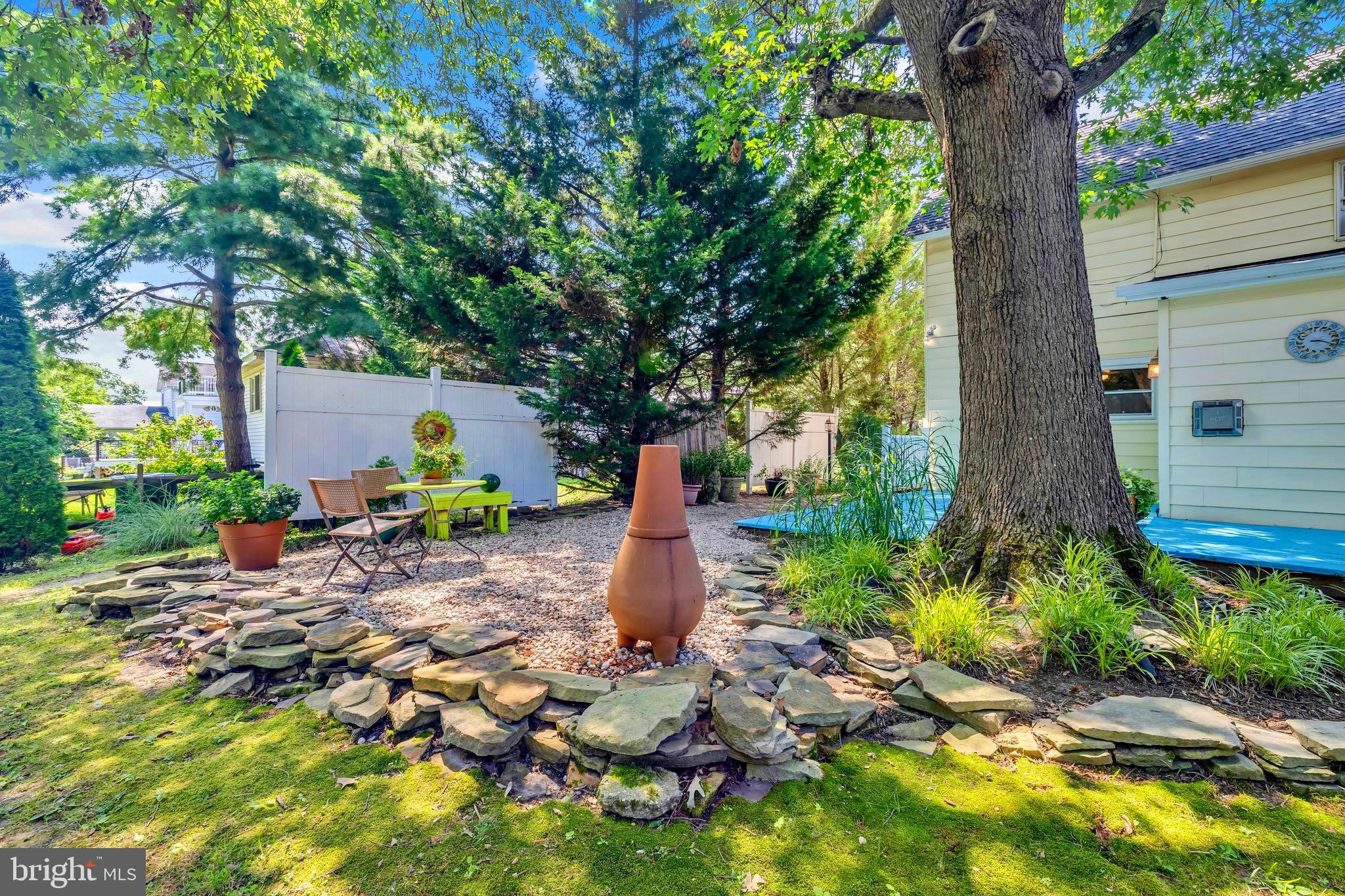 21424 Wharf Road Tilghman, MD 21671 - Photo 29 of 47 a front view of a house with garden