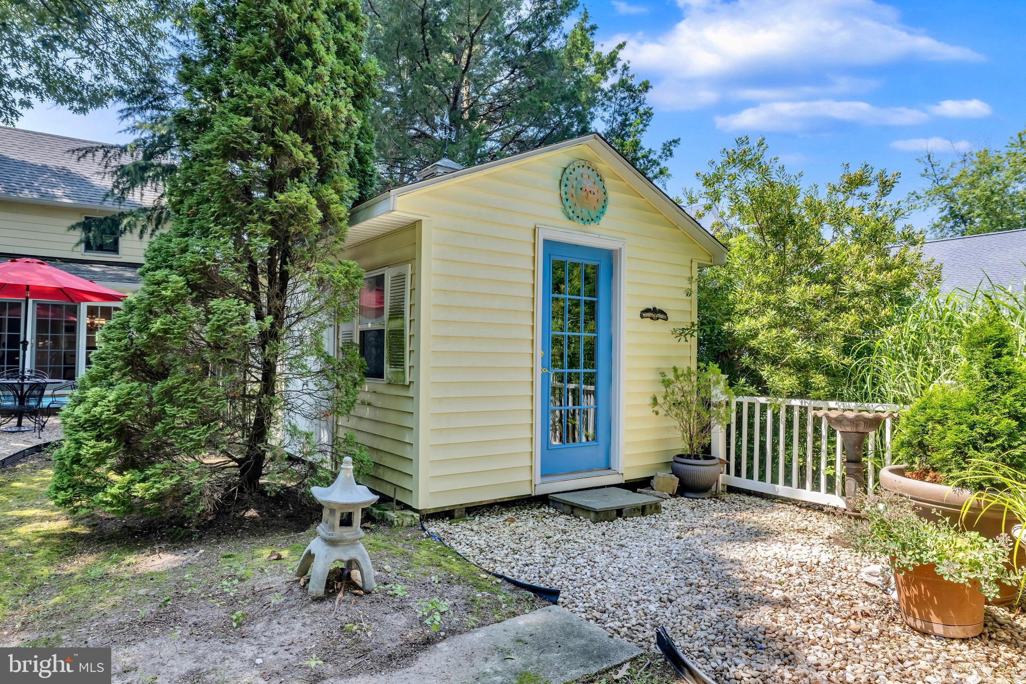 21424 Wharf Road Tilghman, MD 21671 - Photo 30 of 47 a view of a house with a yard plants and large tree