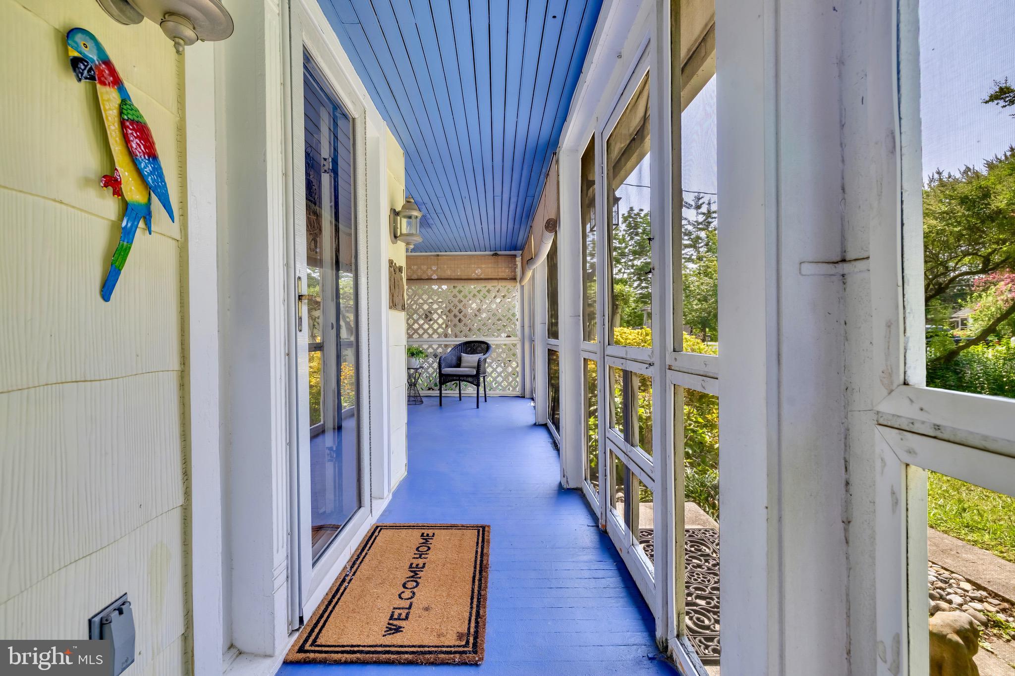 21424 Wharf Road Tilghman, MD 21671 - Photo 3 of 47 a view of a hallway with wooden floor and staircase