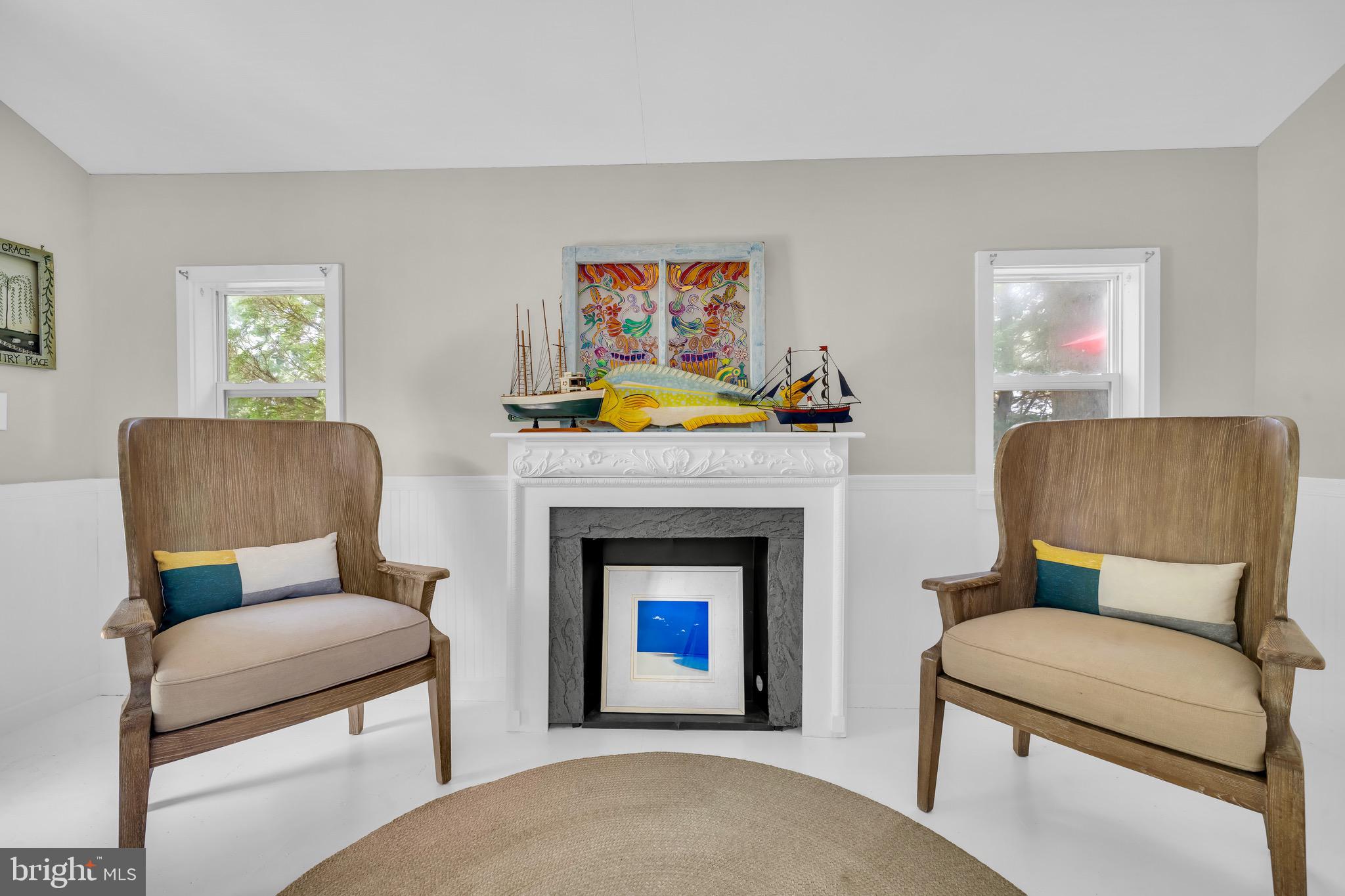 21424 Wharf Road Tilghman, MD 21671 - Photo 31 of 47 a living room with furniture and a fireplace