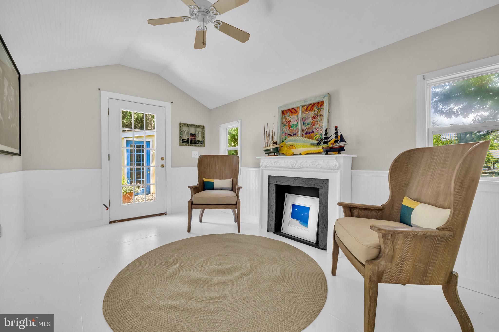 21424 Wharf Road Tilghman, MD 21671 - Photo 32 of 47 a living room with furniture and a fireplace
