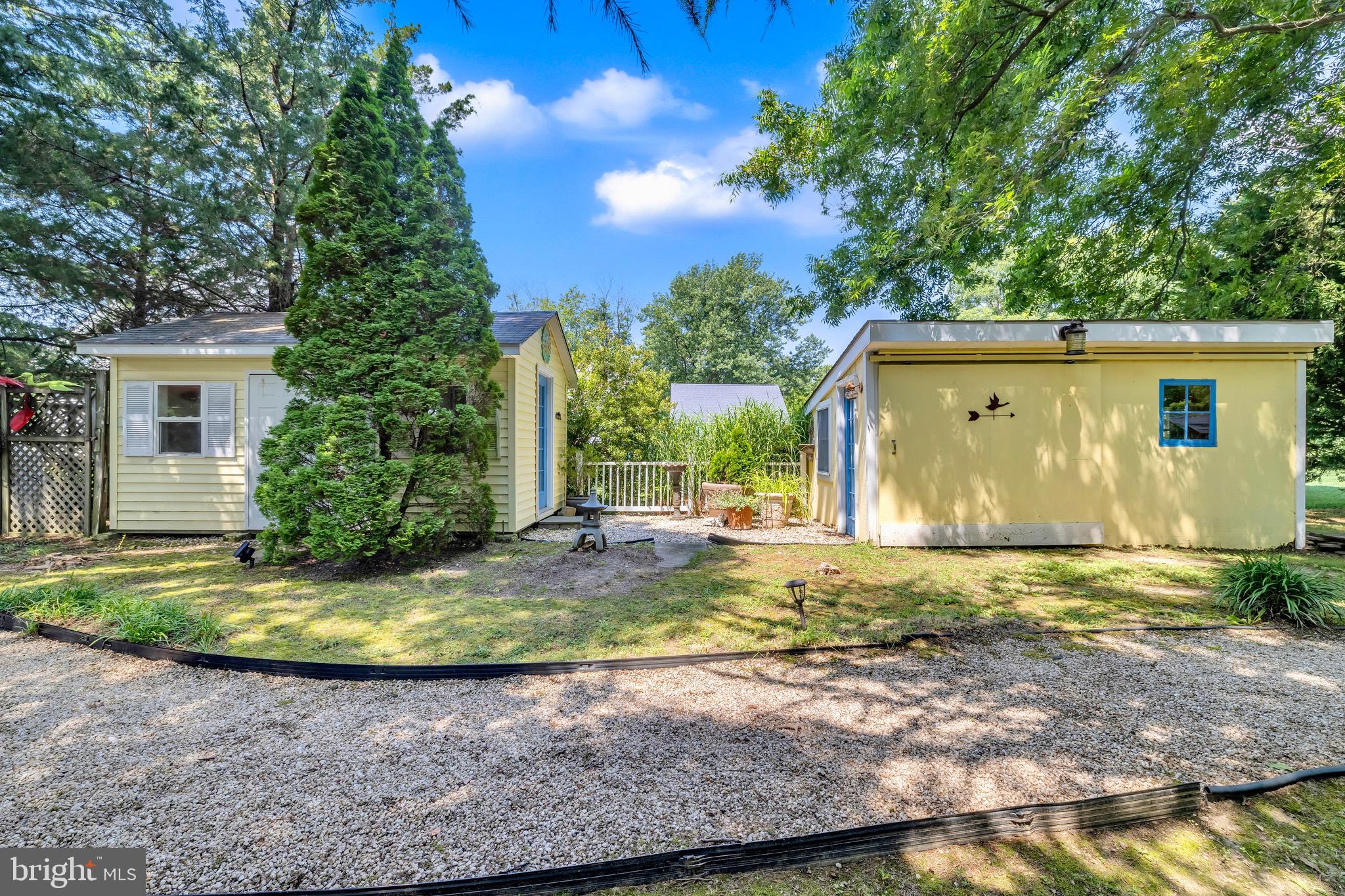 21424 Wharf Road Tilghman, MD 21671 - Photo 33 of 47 a view of a house with backyard and sitting area