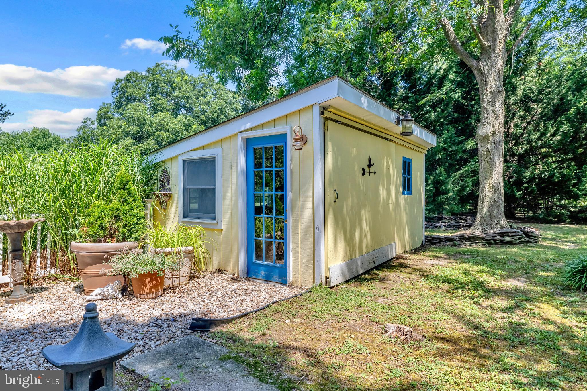 21424 Wharf Road Tilghman, MD 21671 - Photo 34 of 47 a backyard of a house with seating space