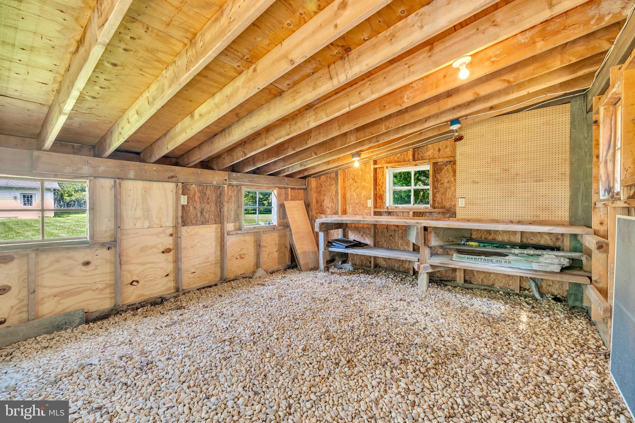 21424 Wharf Road Tilghman, MD 21671 - Photo 36 of 47 a view of a room with wooden furniture and large windows