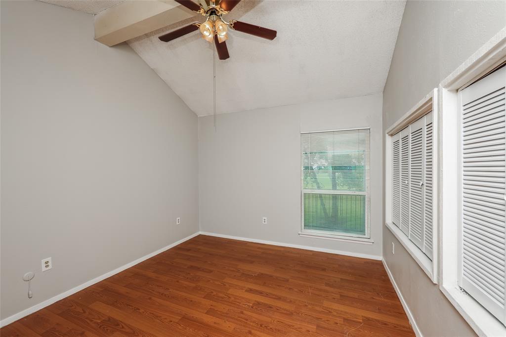 9696 Walnut Street, Unit 1216 Dallas, TX 75243 - Photo 12 of 16 Room featuring wood-finish flooring, a vaulted ceiling, and an overhead fan with lighting