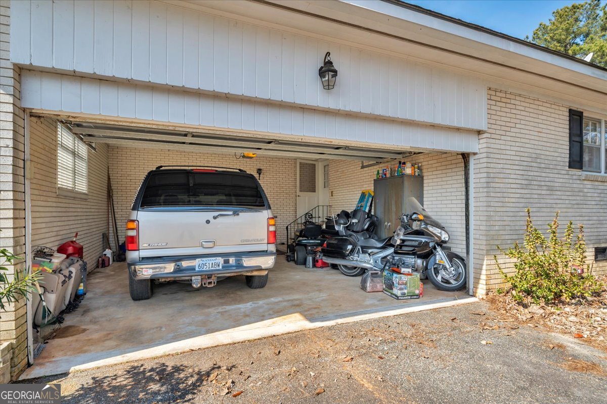412 Red Dog Farm Road Cochran, GA 31014 - Photo 53 of 76 a car parked in front of a house