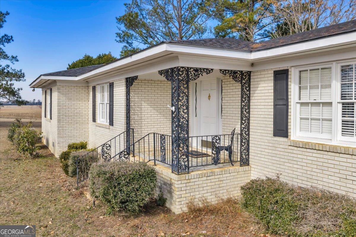 412 Red Dog Farm Road Cochran, GA 31014 - Photo 55 of 76 a front view of a house with garden