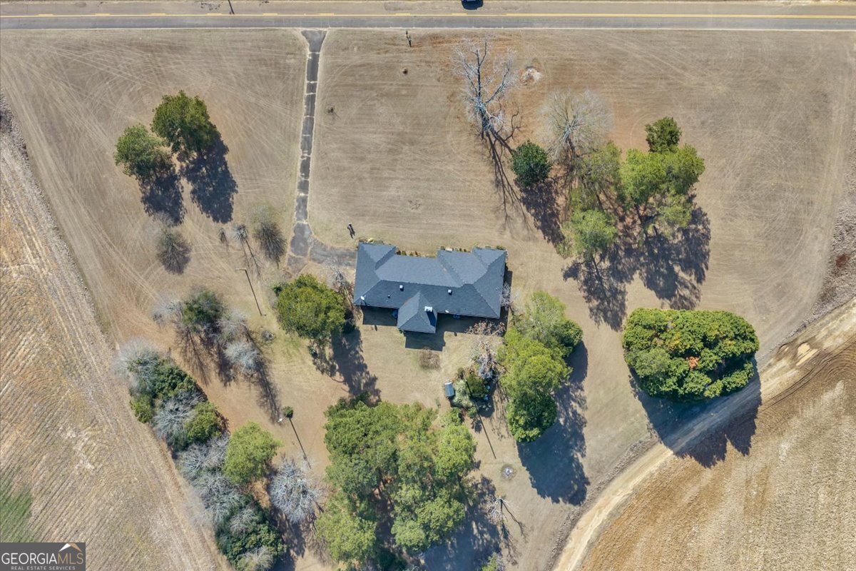412 Red Dog Farm Road Cochran, GA 31014 - Photo 56 of 76 an aerial view of a house with a yard and garden
