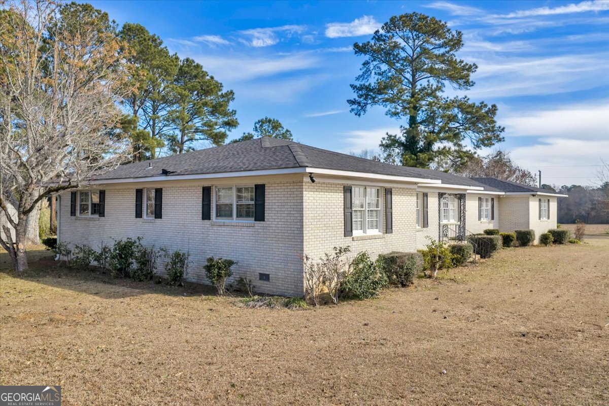 412 Red Dog Farm Road Cochran, GA 31014 - Photo 57 of 76 a front view of a house with a yard