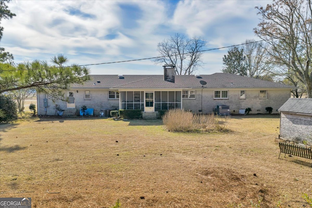 412 Red Dog Farm Road Cochran, GA 31014 - Photo 59 of 76 a view of a house with a yard