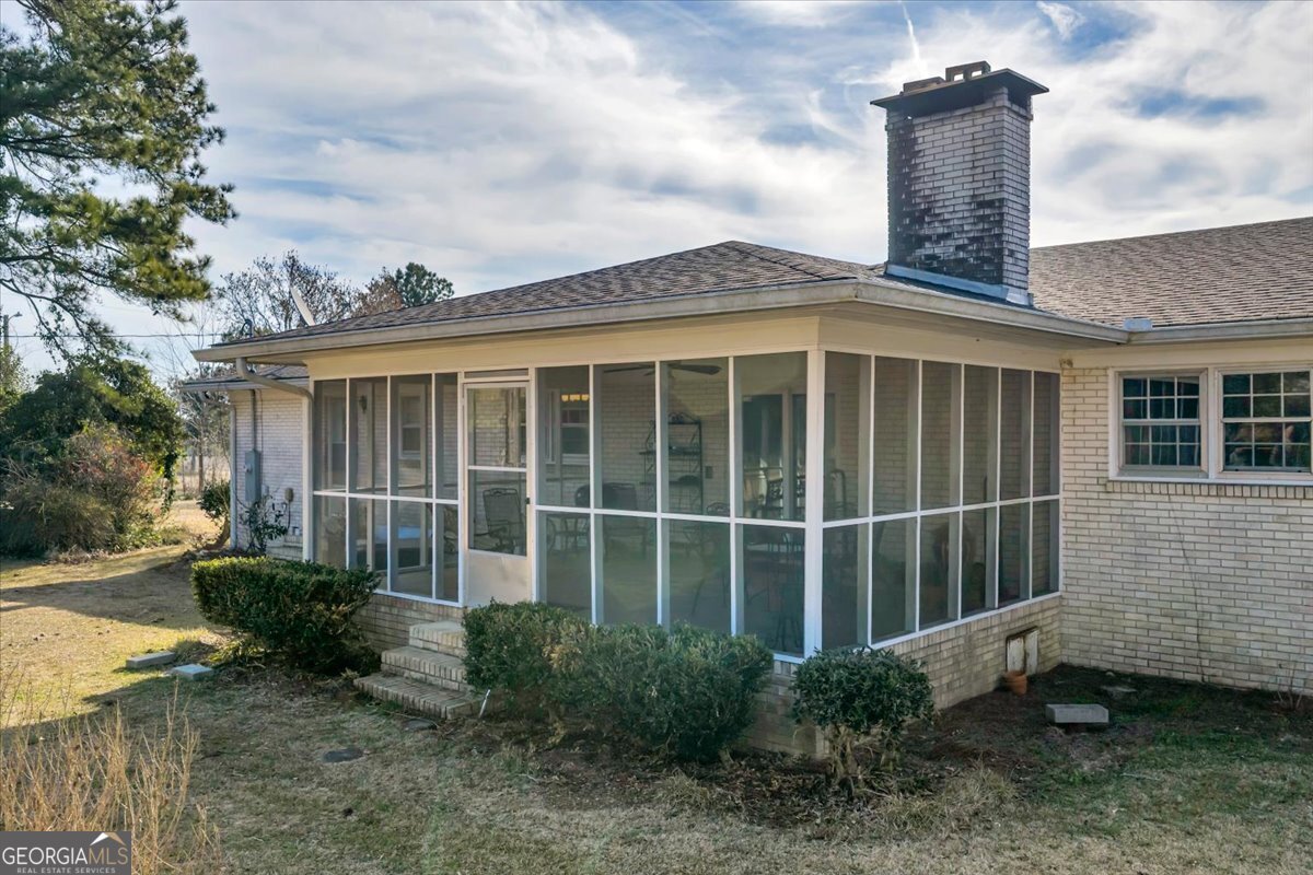 412 Red Dog Farm Road Cochran, GA 31014 - Photo 60 of 76 a front view of a house with a garden
