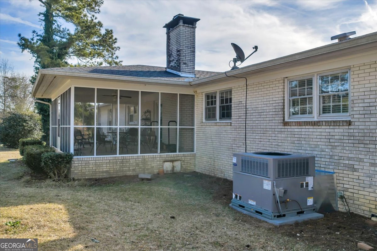 412 Red Dog Farm Road Cochran, GA 31014 - Photo 63 of 76 a front view of a house with a garden