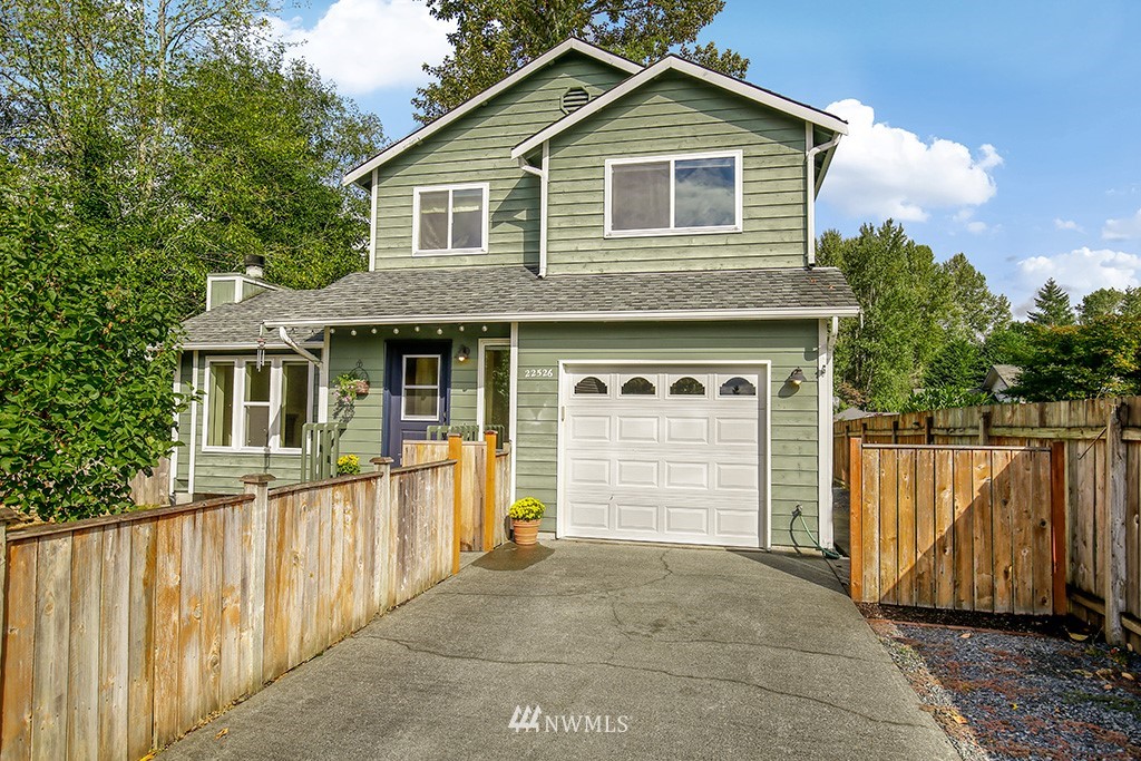 22526 14th Place West Bothell, WA 98021 - Photo 1 of 25 a front view of a house with a yard