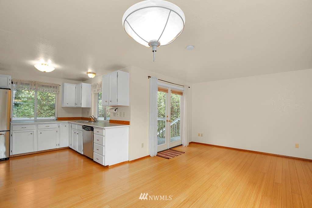 22526 14th Place West Bothell, WA 98021 - Photo 12 of 25 a view of a kitchen with a sink cabinets and window