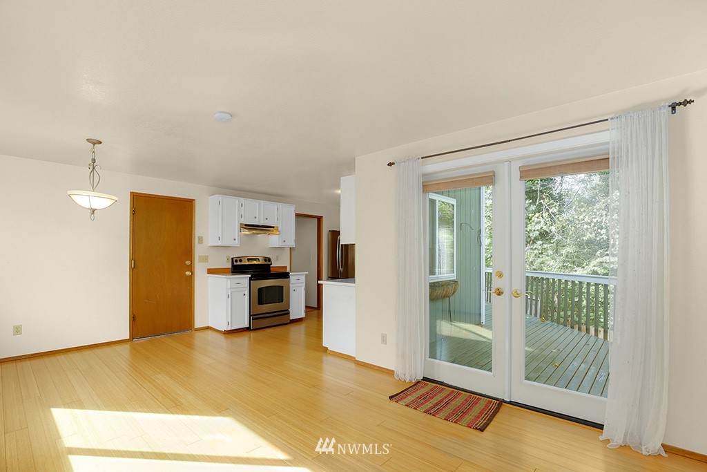 22526 14th Place West Bothell, WA 98021 - Photo 13 of 25 a view of a kitchen with a sink dishwasher and a refrigerator
