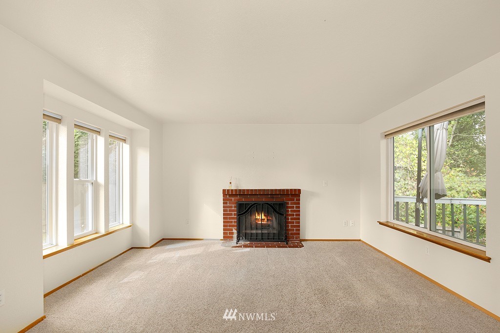 22526 14th Place West Bothell, WA 98021 - Photo 18 of 25 a view of an empty room with a window and fire place