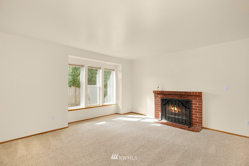 22526 14th Place West Bothell, WA 98021 - Photo 19 of 25 a view of empty room with a fireplace
