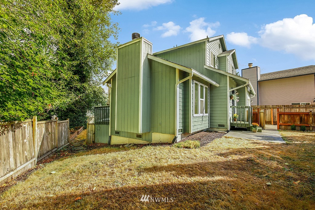 22526 14th Place West Bothell, WA 98021 - Photo 4 of 25 a view of a house with backyard and trees