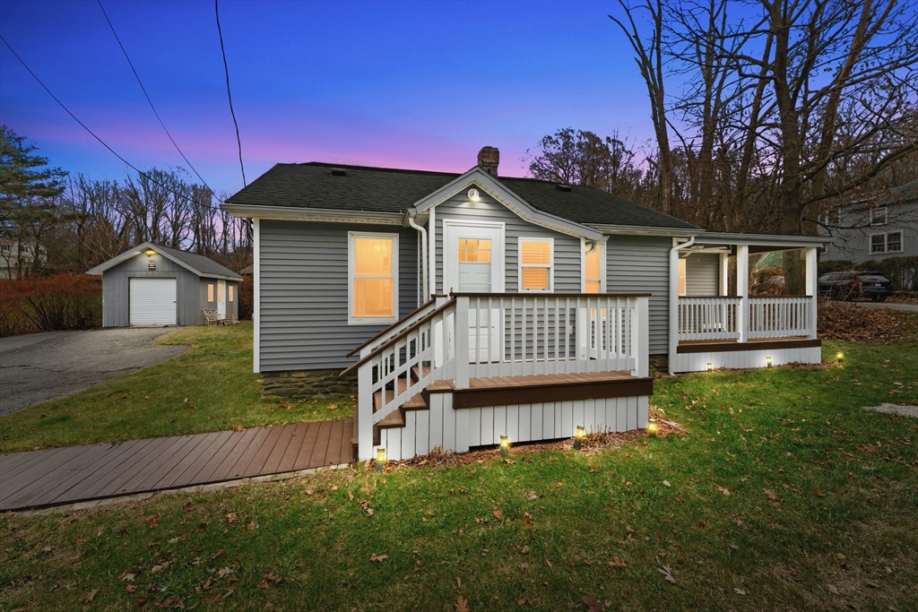 a view of a house with a yard from a patio