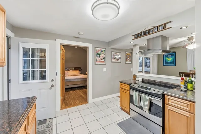 a kitchen with stainless steel appliances granite countertop a stove and a sink