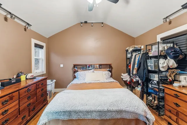 a bed room with a bed and a tv