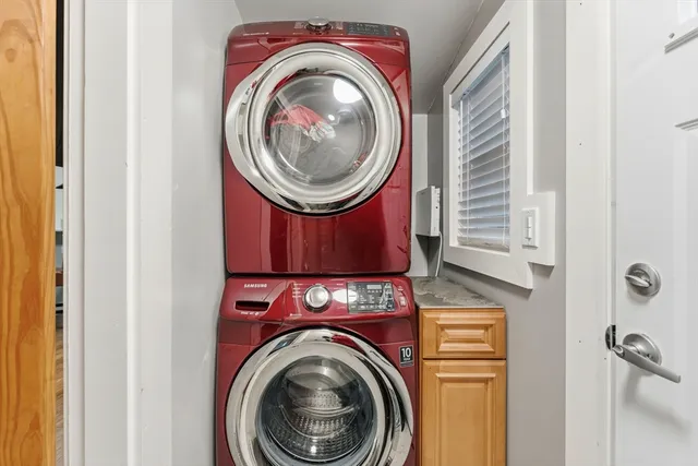 a view of a hallway with washer and dryer