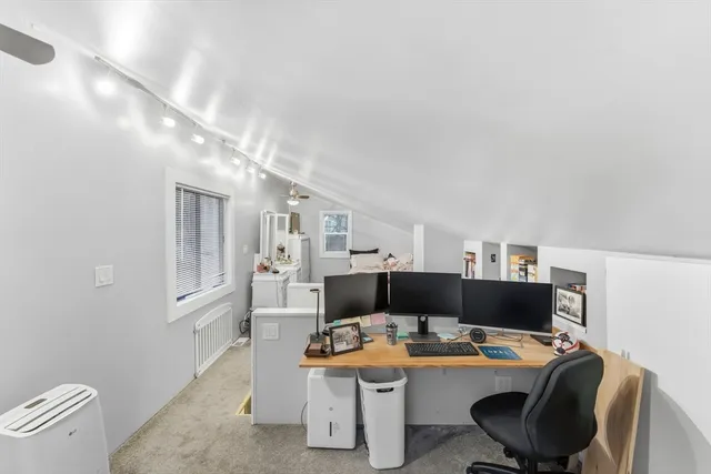 a work room with furniture and a table
